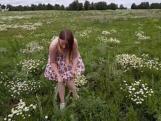 Horny blonde masturbates in the field and reaches orgasm