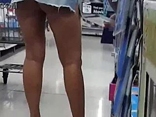 Trina flaunts her ass while shopping in a skirt made from shorts