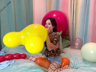 Skinny girl in fishnets gets blowjob and pops a balloon